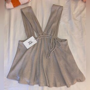 New with tags. Tank top in color taupe. Size Small